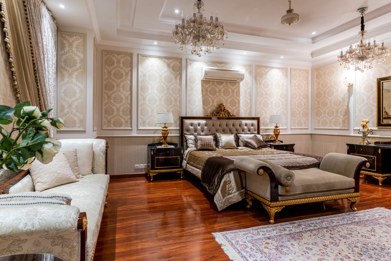 The Art of Drawing Readers In: Your attractive post title goes here Opulent bedroom featuring a grand bed, chandeliers, and rich decor elements.