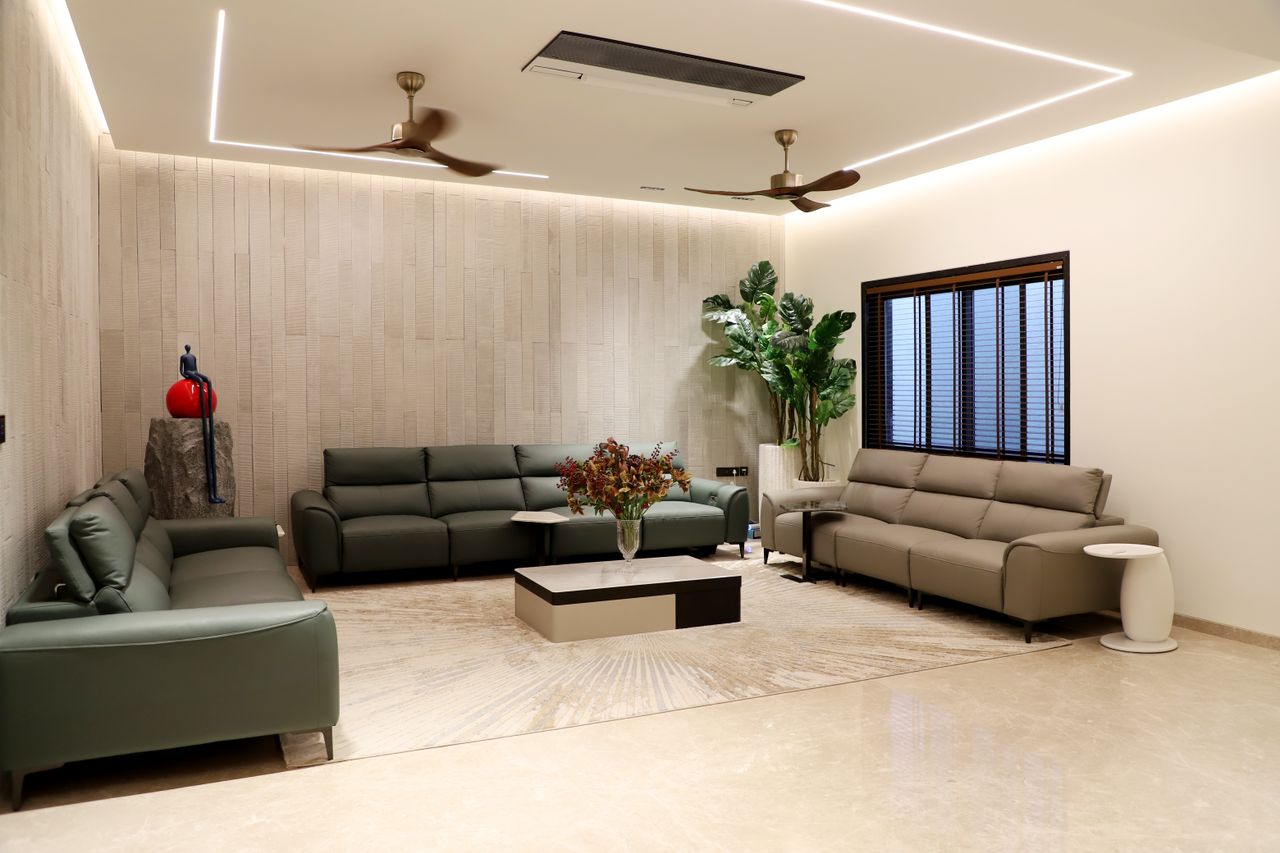 Crafting Captivating Headlines: Your awesome post title goes here Spacious modern living room featuring green sofas, indoor plants, and minimalistic decor.